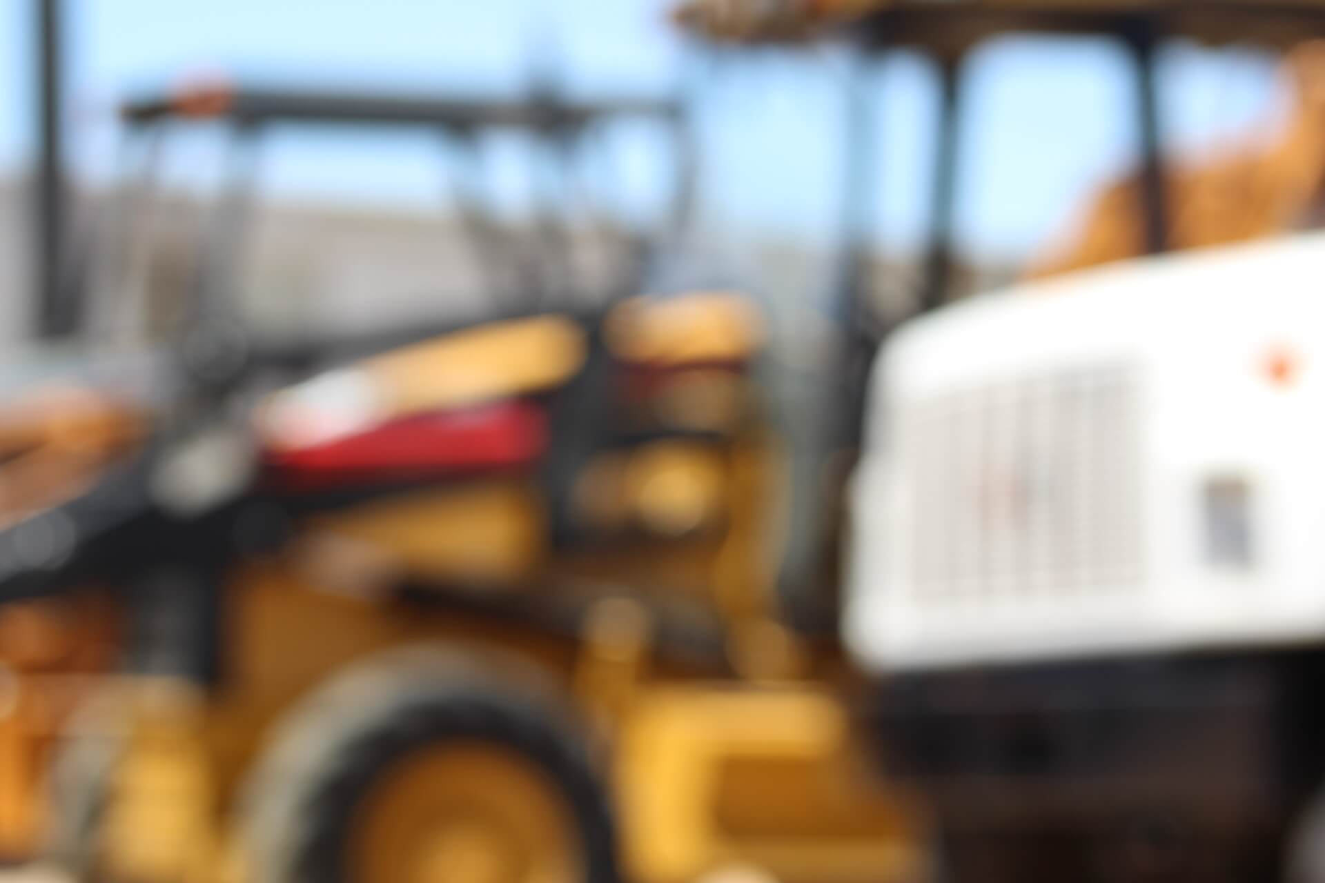 Imagen de fondo con retroexcavadoras y grúas